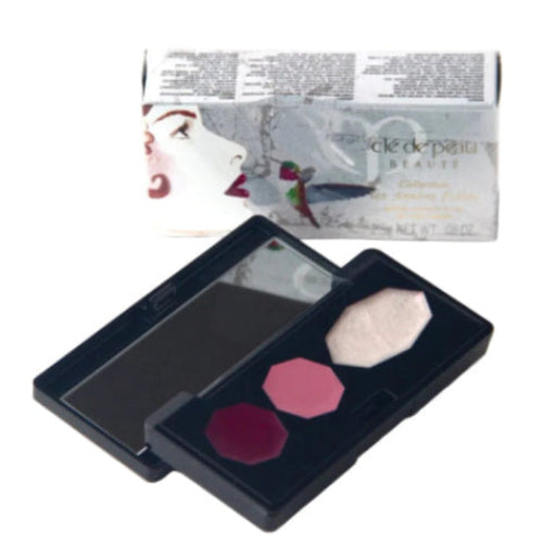 Makeup palette with three colors and a Cle de Peau box in the background