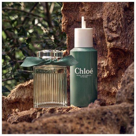 Two Chloe perfume bottles on a textured surface with natural background
