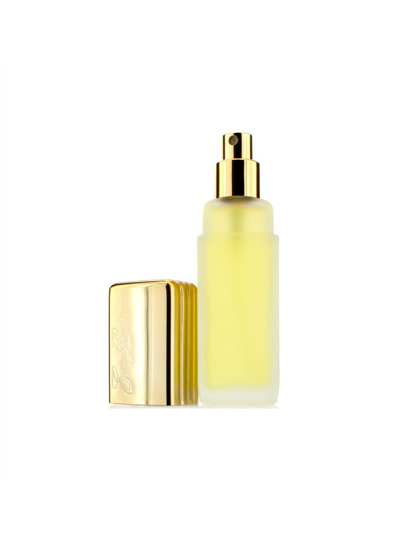Yellow skincare bottle with gold cap on a white background