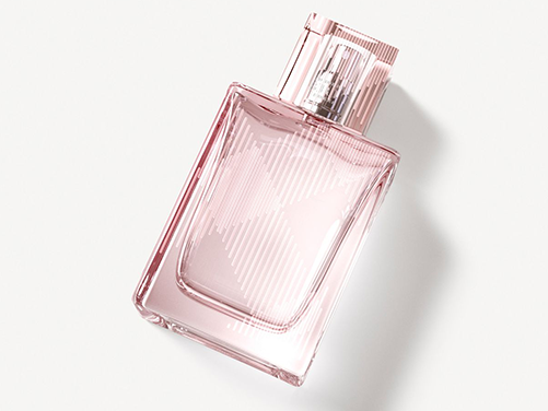 Pink perfume bottle on a white background