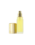 Yellow skincare bottle with gold cap on a white background