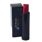 Red lipstick with black casing and 'cle de peau' packaging on a white background