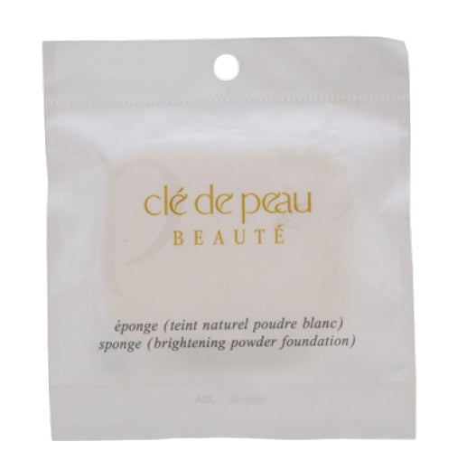 Clé de peau Beauté sponge packaging with gold text on a white background