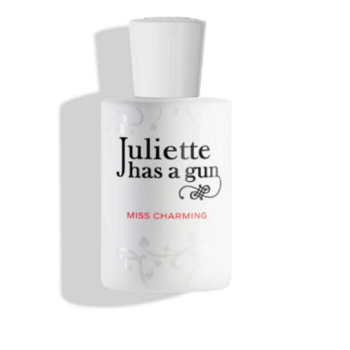 Perfume bottle labeled 'Juliette has a gun Miss Charming' on a white background