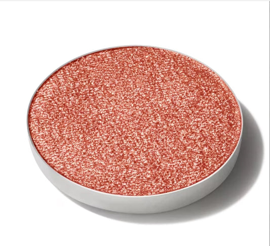 Pink glittery makeup compact on a white background
