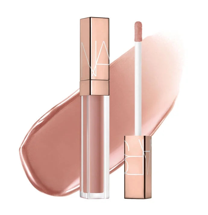 Lipstick with rose gold casing and NARS logo on a white background