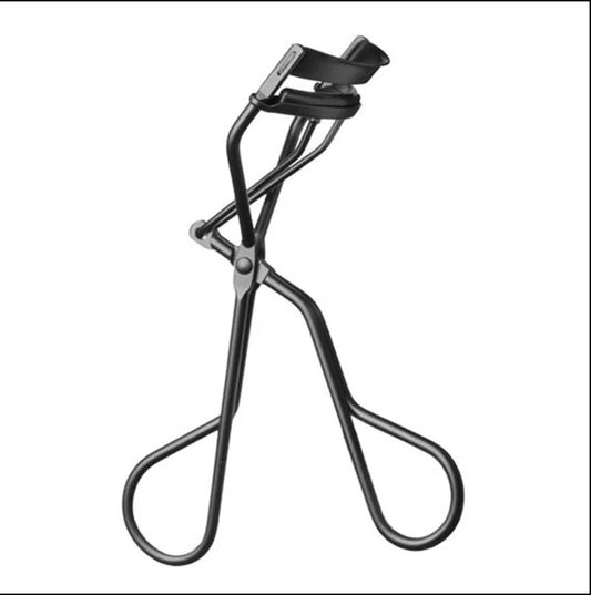 Eyelash curler on a white background