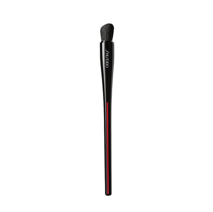 Makeup brush with Shiseido branding on a white background