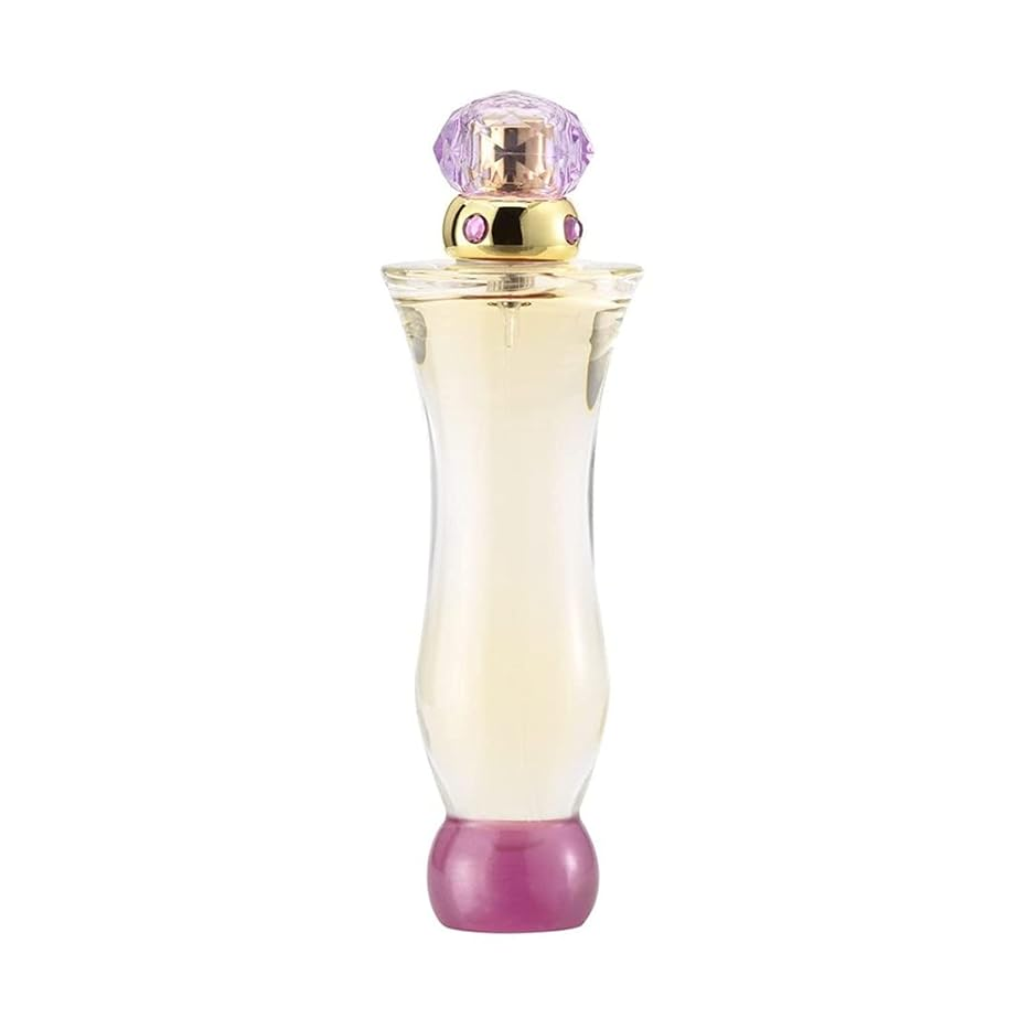 Perfume bottle with a decorative cap on a white background