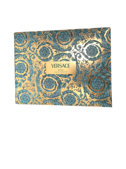 Versace perfume packaging with intricate gold and blue design on a white background